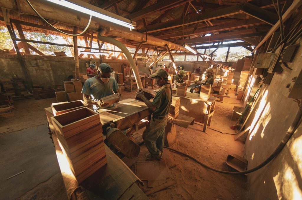 people sitting on chair inside wood working