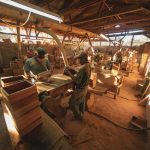 people sitting on chair inside wood working